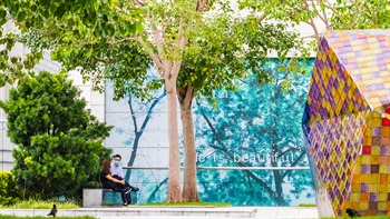 The signature colourful glass sculptures and the greenery forms a vibrant scene in the Rooftop Garden.